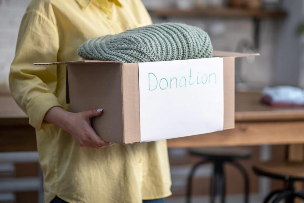 a women donating unused cloth